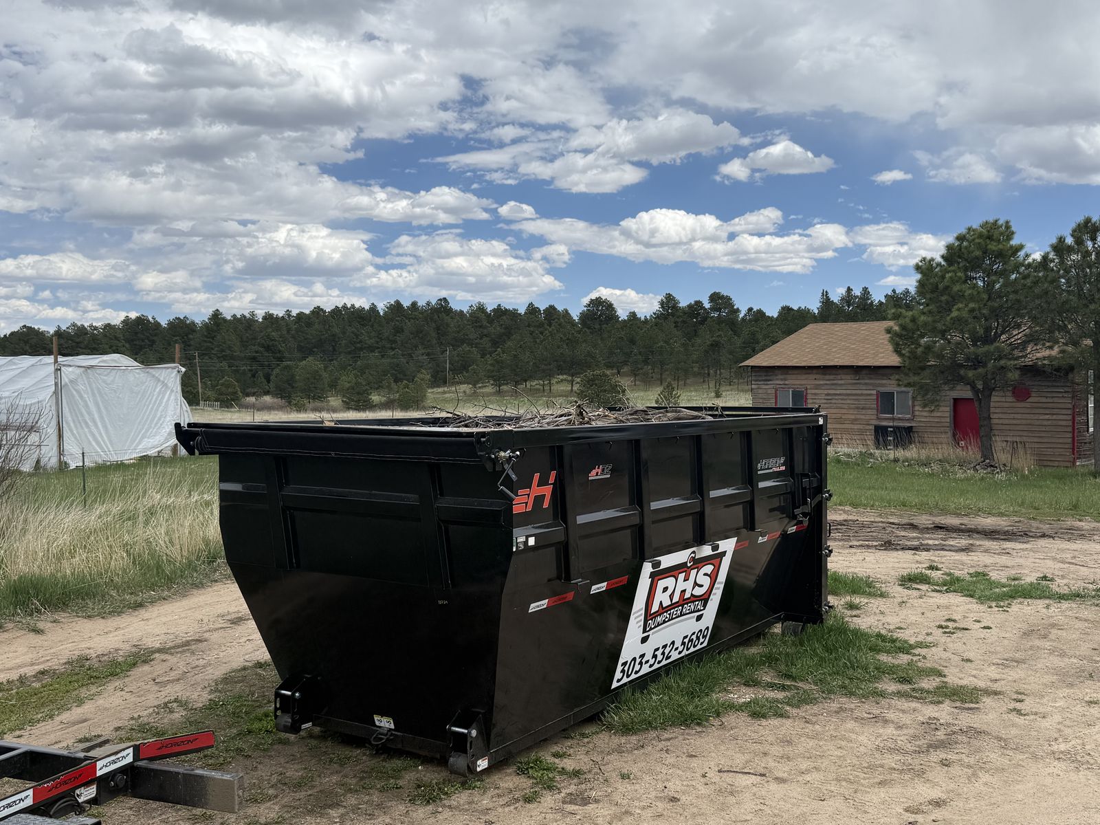 25-yard RHS dumpster filled during a yard cleanup